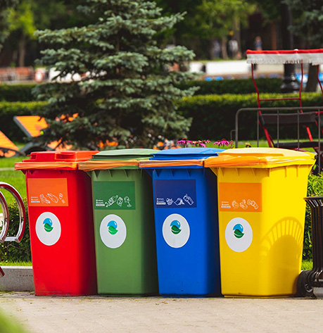 recycling bins sit on a curb