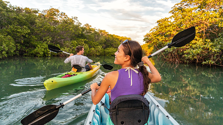 energy conservationists kayak outdoors